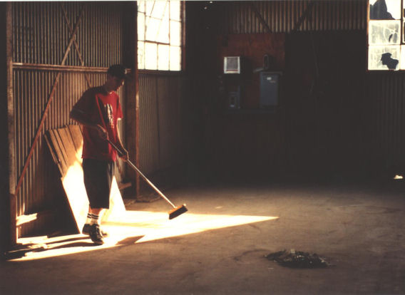 Terry Jacks sweeping out the warehouse in Tarant