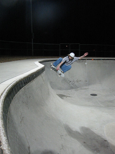 Little Chris....this is not an ollie grab...it is an ollie grab 180 over the hip....that means landing FAKIE!
