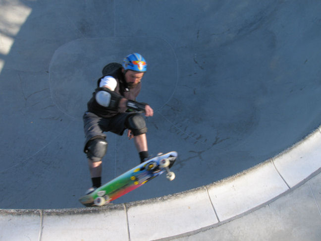 Ken digs in a nice coping wrecking frontside grind at speed