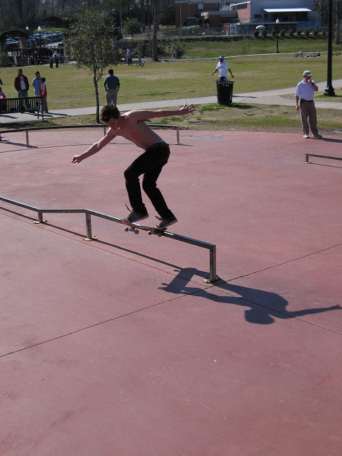 local hits a backside tailslide on the rail