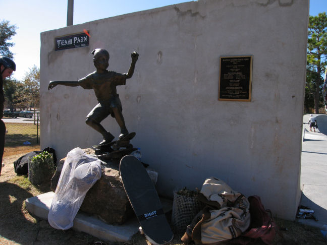 Memorial statue and Team Pain sign on back of the vert wall