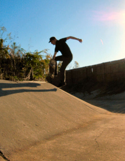 Patrick Jackson boosts a frontside footplant over the hip