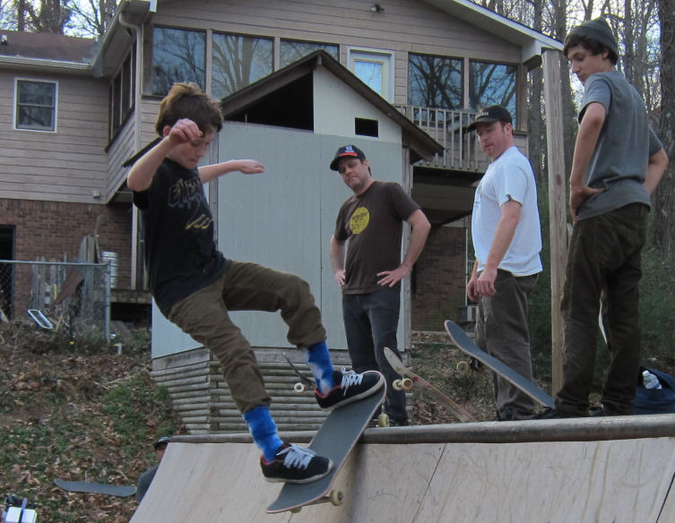 Jason Salillas and his silly socks with a silly smith grind in front of some silly old guys